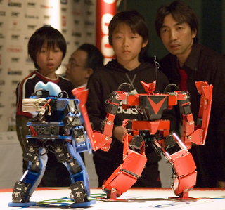 Illustration for article titled Girl Pilots Japanese Fighting Robot With Gundam Master/Slave Control Suit